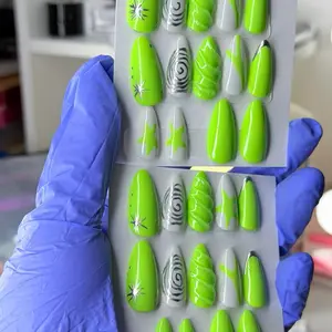 Bright neon green handmade press-on nails with a modern abstract design