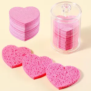 A 50 piece wood pulp cotton face wash puff, a facial sponge with container, a heart-shaped compressed facial sponge natural cleaning pad, used for daily facial cleaning, exfoliating facial mask, and makeup remover, very suitable for family and travel