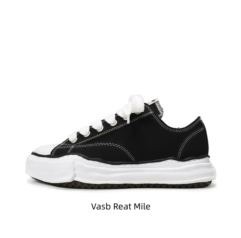 Matte black textured canvas casual shoes with oversized flat white laces pair casual shorts, distorted chunky white sole brings vintage laid-back texture to all everyday casual outfits.