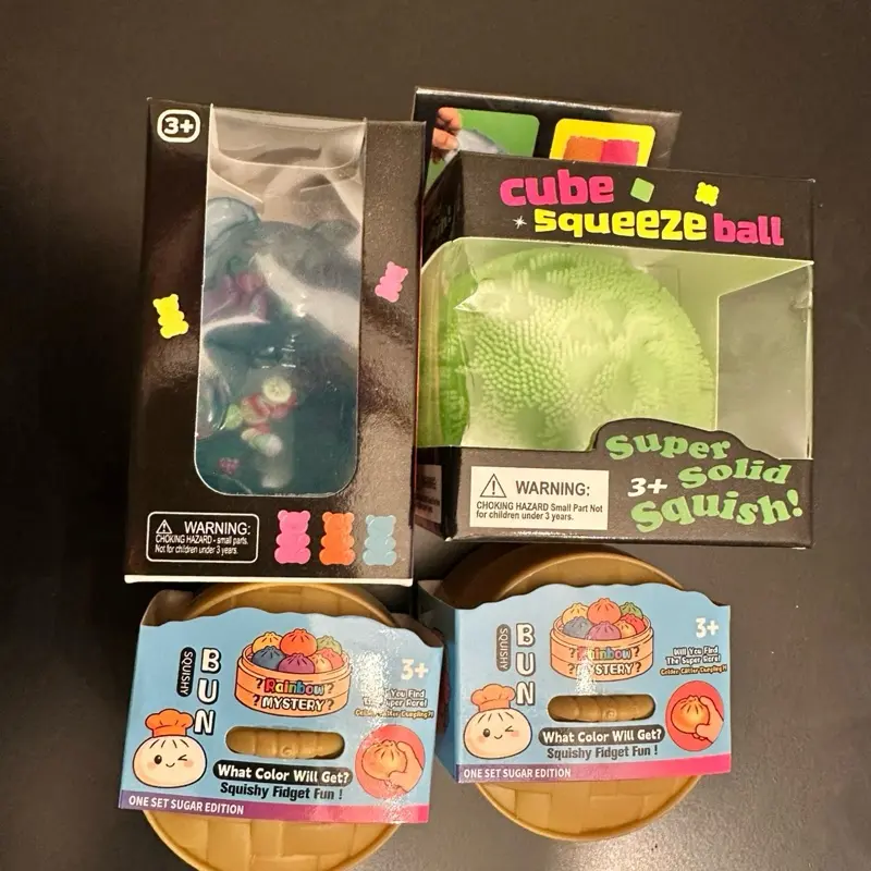 4-Piece Mystery Toy Bundle - 2 Mini Dumplings, 1 Squeeze Fuzz Ball, 1 Fruit-Filled Confetti Gummy Bear
