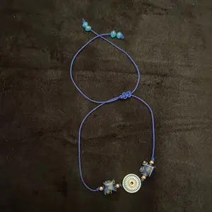 Three Knot Evil Eye Bracelet with Floral Stones - Handcrafted Design for Good Luck and Protection on Blue Fabric String