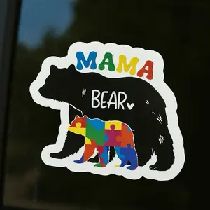 Mama Bear Vinyl Sticker Featuring Puzzle Pieces for Autism Awareness Colorful Design on Pink Background