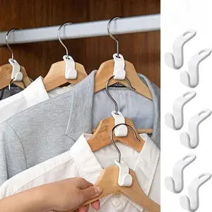 50 durable plastic hangers with connectable hooks – a space-saving multi-hook system ideal for organizing closets in homes, apartments, and dormitories. Essential for home and dormitory use. Simple design, practical hooks.