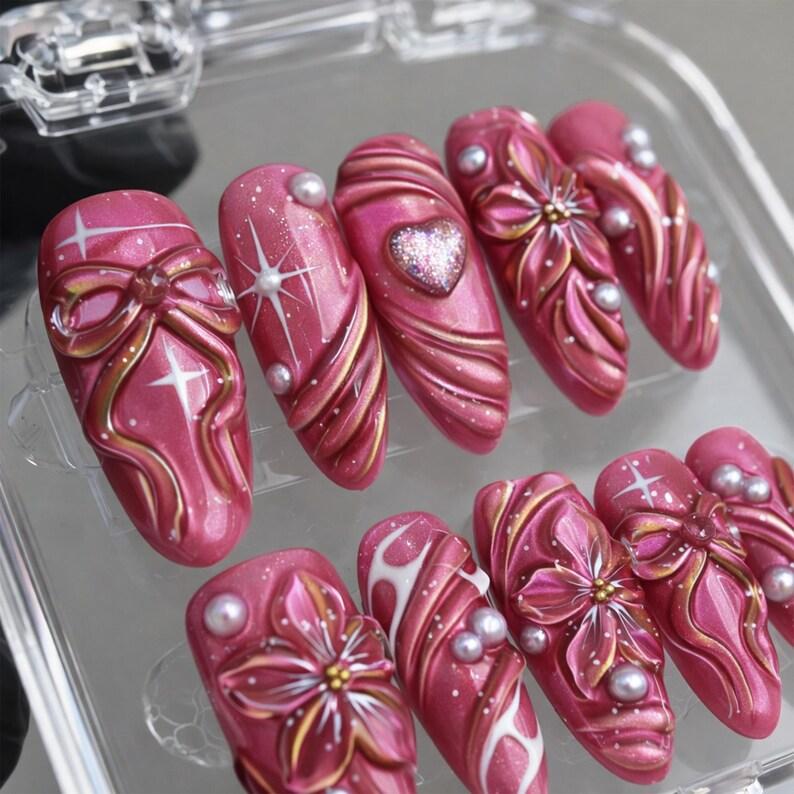 Cute sparkly pink cat eye handmade press on nails with 3D pearl flower and bow art, reusable custom size nail box perfect for sweet gift ideas