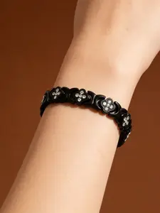 "Level up your daily look! Our black four-leaf clover bracelet features dazzling crystals, hassle-free magnetic closure, comfy enough for non-stop wear. #FashionEssential"