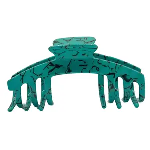 The Emily Turquoise Claw Clip with smooth, swirling patterns for a stylish and elegant look Hair Accessory designed for adjustable hats