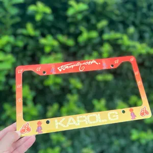TROPICOKETAAA  License Plate Frame - Orange and Yellow Design with "KAROKG " Text and Cartoon Characters