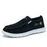 Women's Slip-On Black Canvas Sneakers with Embroidery Details
