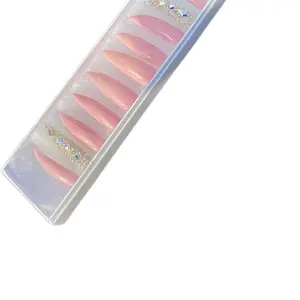 Pink curves, stiletto, bling nails made with acrylic. Long lasting and reusable.