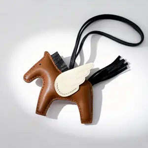 Heritage Luxe Shop Handmade Pegasus Leather Bag Charm Winged Horse Keychain Brown & Cream Bag Accessory Gift for Her Elegant Design Premium Craftsmanship
