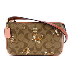 Coach Nolita 19 Cat Print Multi-Pocket Crossbody Bag for Women in Tan Monogram Coated Canvas and Smooth Leather