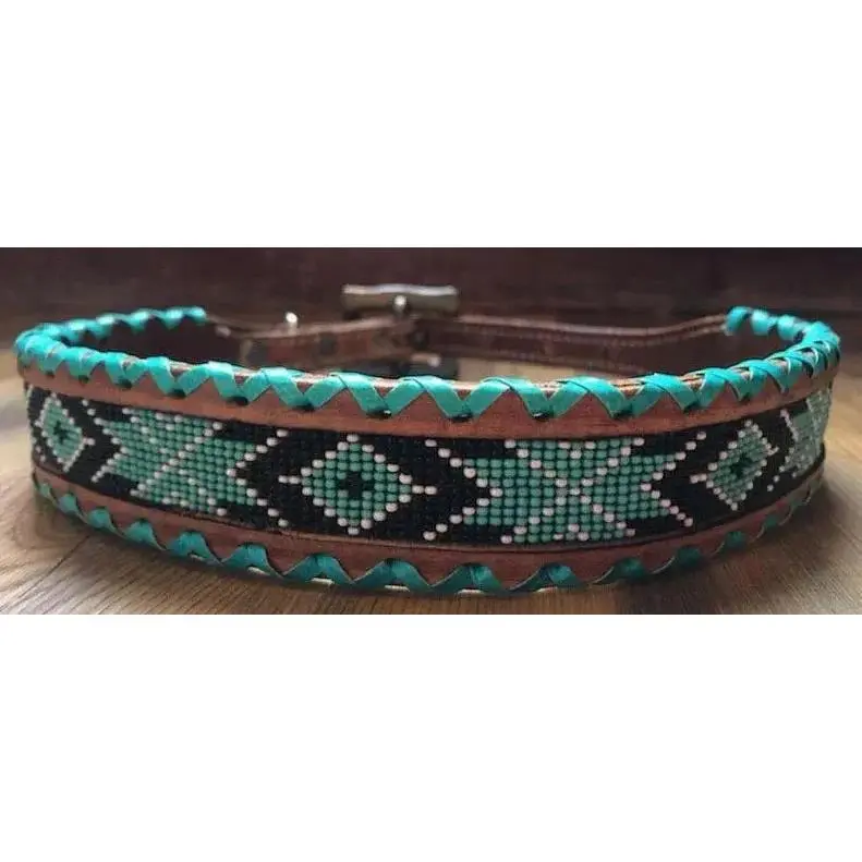 Genuine leather dog collar with teal, white, and black southwest beaded inlay design, a rawhide wrapped edge Genuine leather dog collar with teal, white, and black southwest beaded inlay design, a rawhide wrapped edge