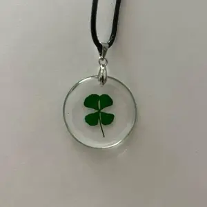 Four Leaf Clover Necklace - Elegant Design with Four Leaf Clover Pendants, Crafted from Acrylic Green Material, Perfect for Any Occasion