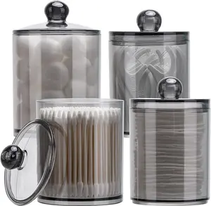 Set of 4 Plastic Apothecary Jars with Lids, available in 10-ounce and 12-ounce sizes, perfect for organizing bathroom accessories. Ideal storage solution for cotton balls, cotton swabs, and dental floss, featuring a sleek black design