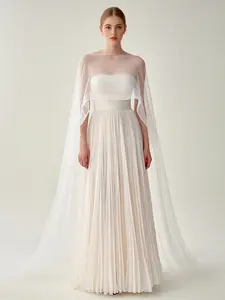 Elegant White Pleated Gown With Sheer Cape Overlay