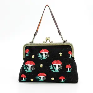 Vintage Chic Canvas Kiss-Lock Purse with Embossed Patterns and Detachable Straps