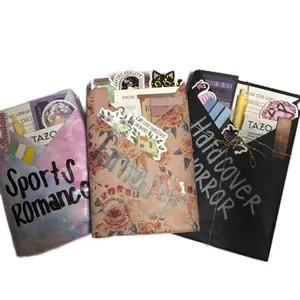 Triple Blind Date With A Book- 3  BDWB! This includes three paperback books, colorful page tabs, a handcrafted tea blend, fun stickers, a reading tracker, a stylish bookmark, and a vibrant colored pen for the ultimate reading experience.