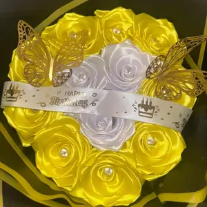Rosas Eternas with Gold Butterfly Ribbon and White and Yellow Roses