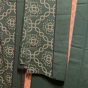 Green Baati with Intricate White Dot Patterns and Pink Trim