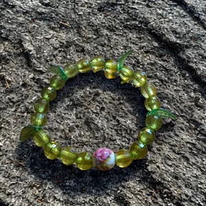 Green Beaded Bracelet with Floral Accent and Leaf Design for Women's Fashion Accessory