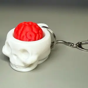 Skull Clicker Fidget Toy with Key Ring Optional Keychain Very In Colors White and Red Red Brain Design Compact and Fun