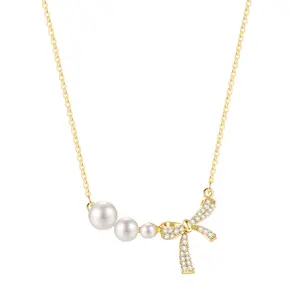 EAMTI Dainty 14K Gold Plated Pearl Bow Necklace with Cubic Zirconia Adjustable Chain Hypoallergenic Jewelry for Women Perfect for Weddings & Everyday Wear