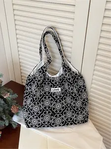 Relaxing Embroidered Flower Letter Logo Tote Bag | Simple silhouette+Embroidered flower fabric+Letter logo, with practical storage properties, suitable for daily commuting, short trips, school attire, business trips, etc., with a relaxed commuting style f