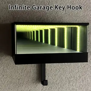 Creative LED Infinity Garage Key Hook, featuring a novel deep mirror infinity tunnel garage design, suitable for home decoration and car key storage. It can hold 1:64 scale car models, which need to be purchased separately.