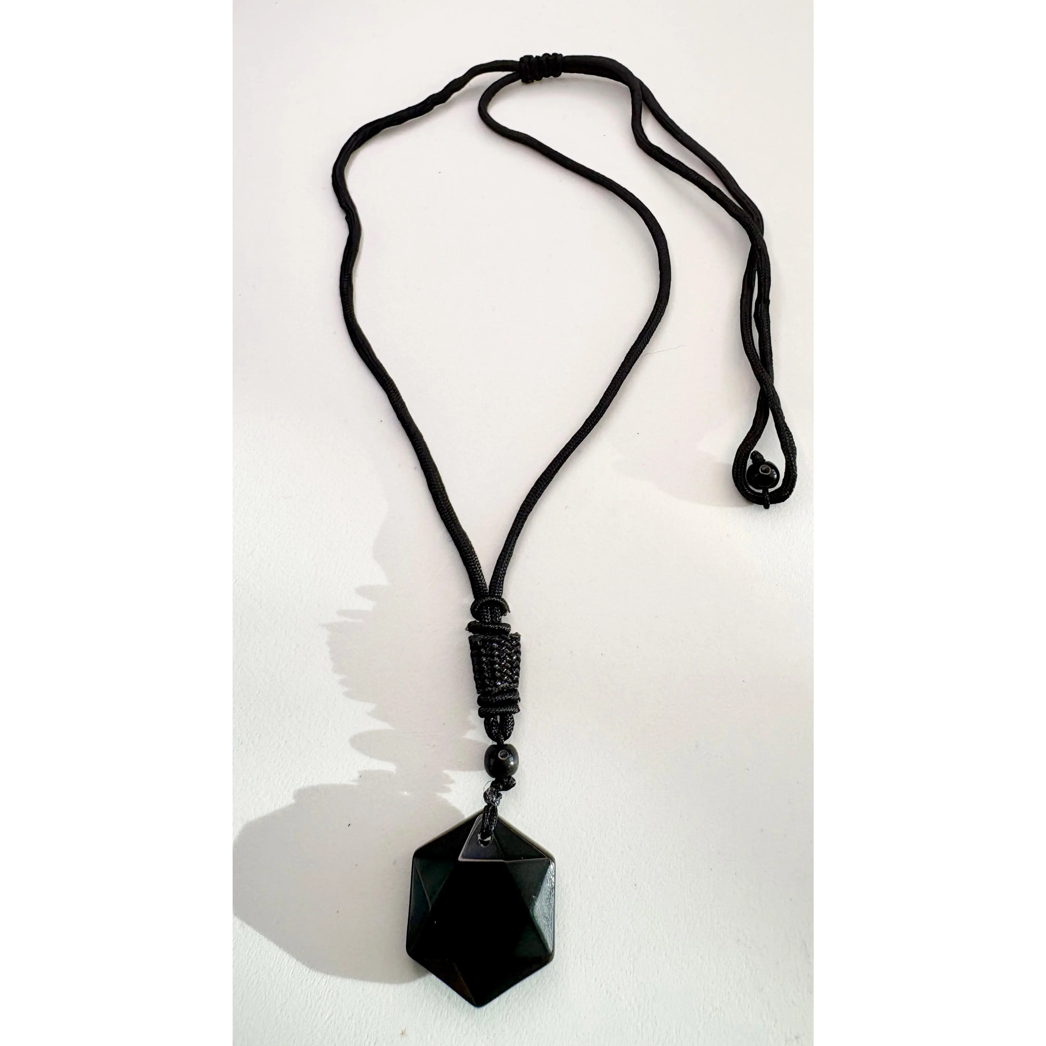 Carved Obsidian pendant