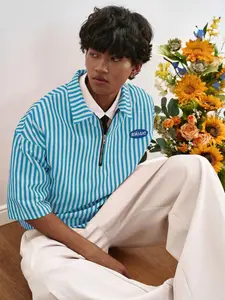 Men’s and women’s versions of a red-striped, semi-zip, short polo shirt with a retro street style, collegiate-inspired top, label design, casual and stylish shirt | everyday wear, trendy summer tops.