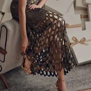 Elegant Gold and Black Crochet Midi Skirt with Intricate Patterns and Flowing Design for a Chic Look