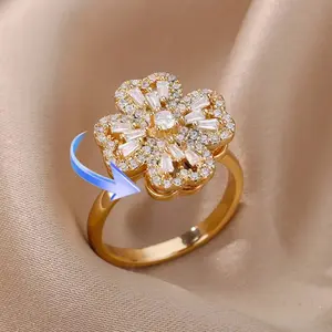 Spinning Four-Leaf Clover Ring, Gold Plated with CZ Stones. Adjustable, Fidget-Friendly Design. Trendy Jewelry for Stress Relief & Gifting.
