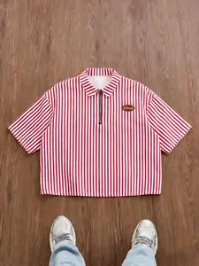 Men’s and women’s versions of a red-striped, semi-zip, short polo shirt with a retro street style, casual short-sleeved shirt, collegiate-inspired top, label design, casual and stylish shirt | everyday wear, trendy summer top.