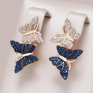 A Pair of Elegantly Styled Butterfly Hoop Earrings Perfect for a Fashionable Party.