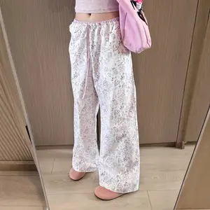 New casual relaxed trousers with contrasting color waistband and adjustable cuffs, available in graffiti print/dot print