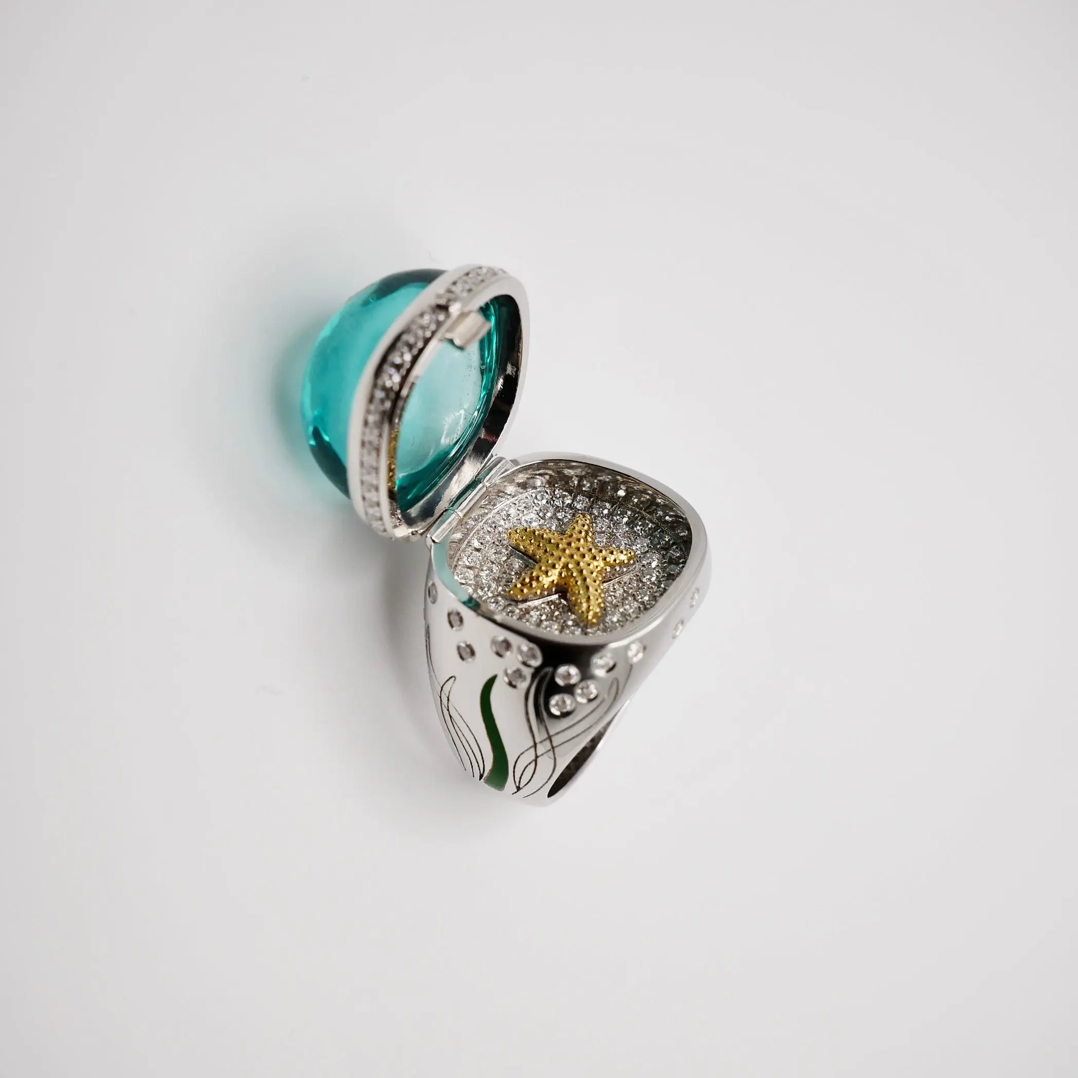 Aquamarine Cabochon Ring with Hidden Opening Starfish