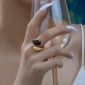 Elegant Adjustable Black Gold Open Ring - Unique design inspired by yin and yang, suitable for everyday wear or special occasions