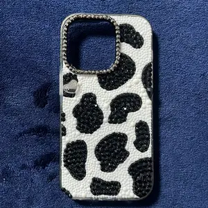 Blingy Finesse iPhone 14proe Case with Black Leopard Print and Rhinestone Accents for Stylish Protection