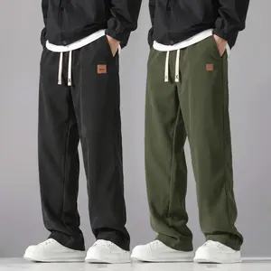 Men’s corduroy casual pants with leather tag decoration; sports/outdoor jogging pants; loose, drapey casual athletic pants with a trendy wide-leg, floor-length design; versatile for everyday wear; comfortable adjustable waistband; durable fabric suitable