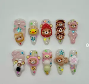 Adorable kawaii nail set featuring 3D Rilakkuma bears, colorful stars, bows, and sweet designs for a cute, playful, and fun look perfect for anime lovers