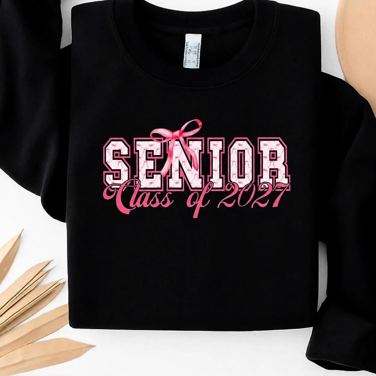 Senior Class of 2027 Sweatshirt - Cute Pink Bow Graduation Pullover - Cozy Unisex Senior Year Gift for High School & College Students - 100% Cotton for Dark Heather & Heather Colors - Soft & Comfy First-Rate Shirts , The Mug Club USA