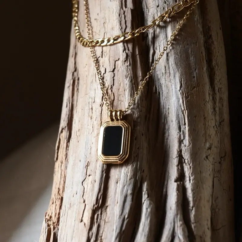 Charming Dahlia Necklace with Gold Chain and Square Pendant Featuring a Black Stone