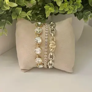 Bracelet Stack includes Round Cut Link Bracelet, Tennis Bracelet and Two Tone Magnetic Closure Bracelet