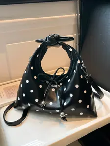 The polka dot pattern women's contrasting handbag crossbody bag is a lightweight, simple, personalized and niche women's bag, a casual women's bag, suitable for daily occasions such as commuting, shopping, dating, parties, and going out.