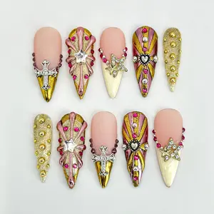 Handcrafted Gold Almond Press-On Nails | Rhinestones and Cross Charms Designs | Unique Luxury Nail Art | Elegant Details