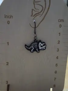 Triceratops skeleton plastic dangly earrings