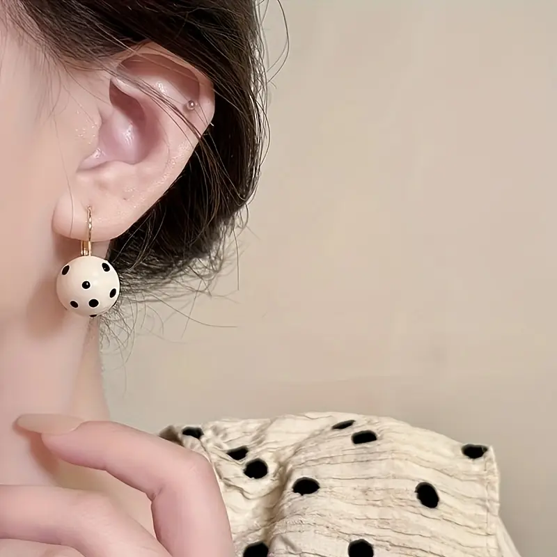 Fashionable black and white polka dot dangling earrings, the perfect accessory for any outfit
