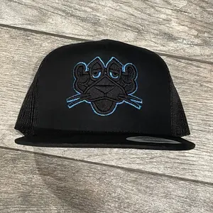 Panther Metallic Blue Puff Embroidery Trucker Hat.