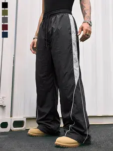 Men’s black color-block athletic pants with white side stripes and embroidery design, loose jogger long pants, trendy street fashion running pants, drawstring waist, straight leg cut, polyester men’s pants, Mother’s Day gift