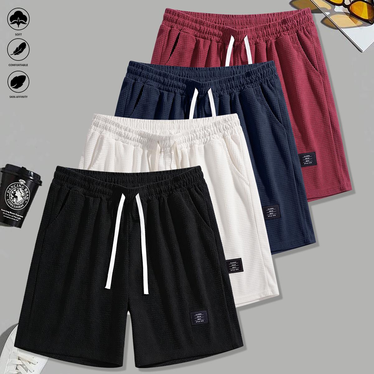 Set of 4 men’s summer new loose casual athletic shorts featuring an elastic waistband with drawstring adjustment, side pockets for convenient storage, knit fabric—ideal for running, workouts, outdoor activities, and everyday wear.